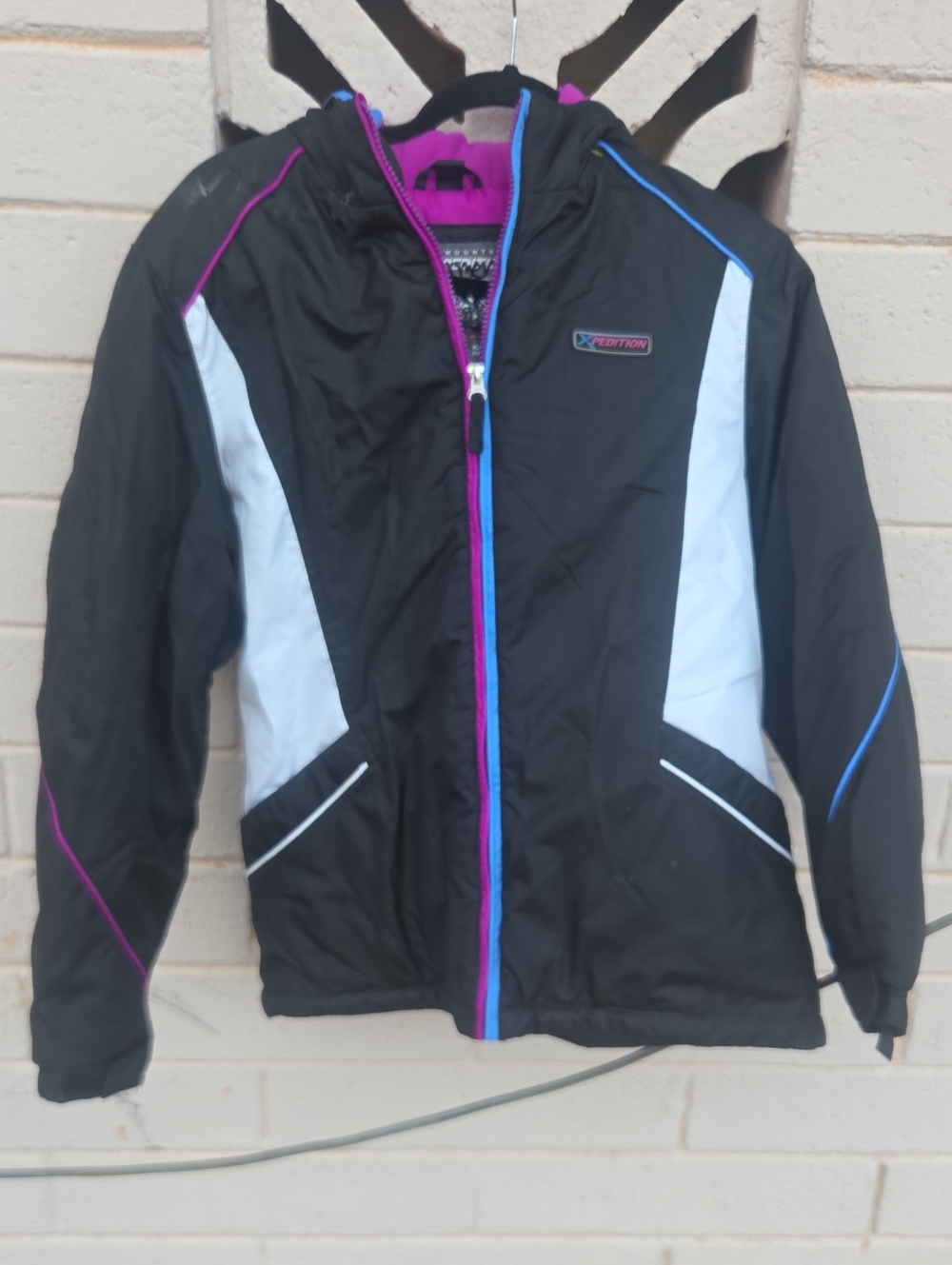 Kids Black Hooded Puffer Jacket with White Panels and Pink & Blue Trim -